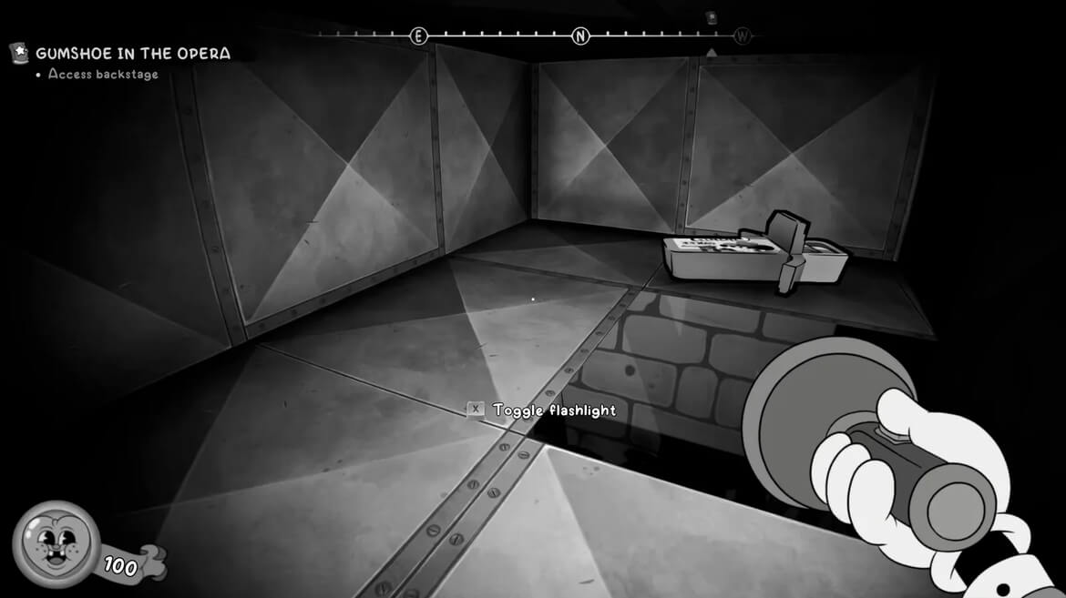 Firstperson view in a grayscale backstage area hand holds a flashlight toward a toolbox objective GUMSHOE IN THE OPERA Access backstage