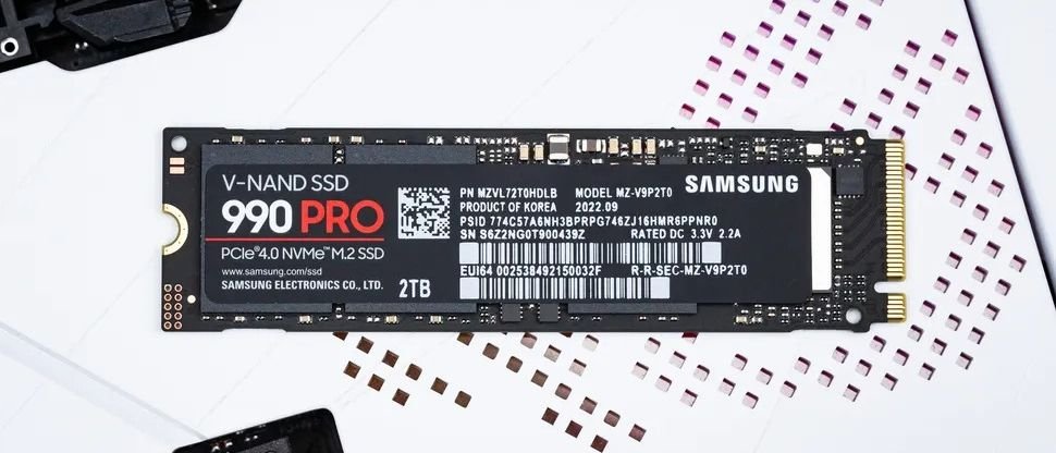 Samsung 990 Pro 2TB NVMe M2 SSD with PCIe 40 placed on a white desk surface