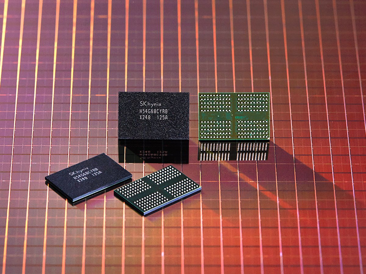 Four SK hynix memory chips arranged on a pink red grid surface some chips stacked