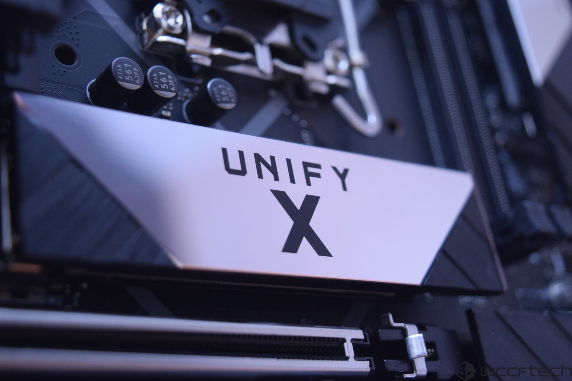 Close up of server components inside a computer with a white UNIFY X label visible on a panel