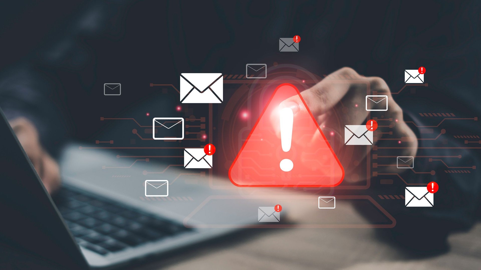 Red warning triangle with a bright exclamation surrounded by floating email icons signaling a phishing or cybersecurity alert