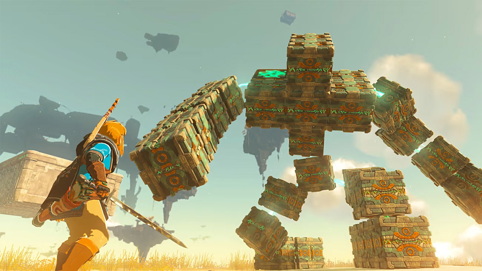 Hero with a sword faces a massive golem built from glowing teal ornamented stone blocks in a sunny desertscape