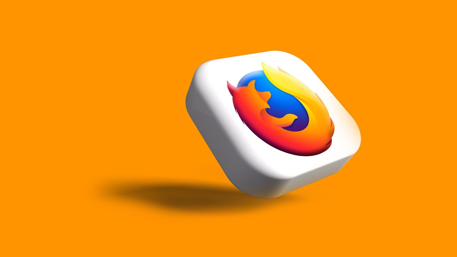 Firefox logo floating on a white tile against an orange background tilted diagonally