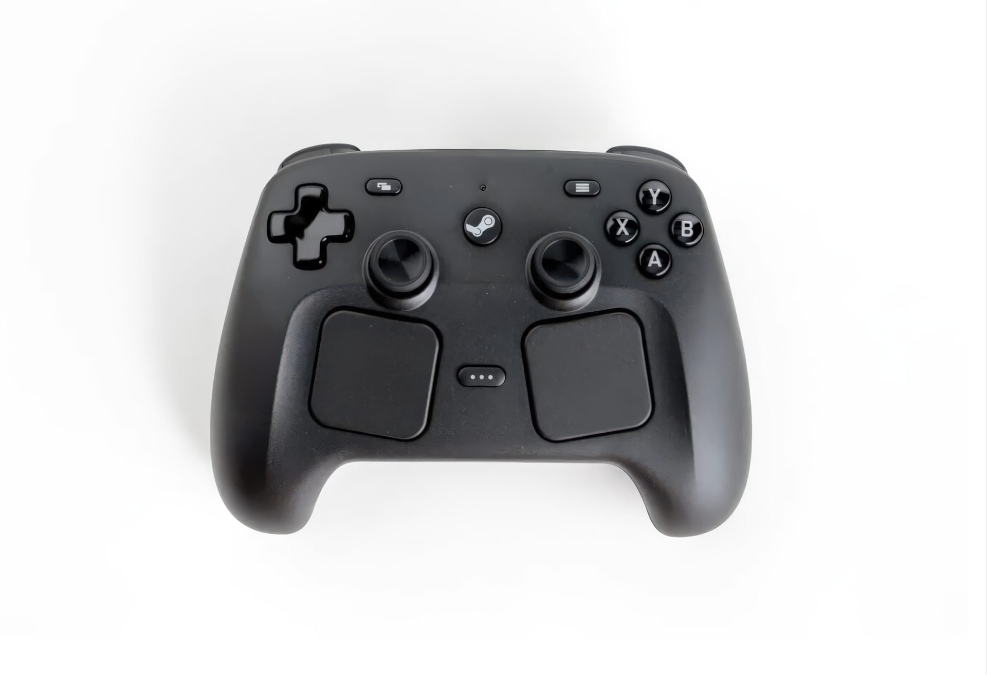 Top view of a black game controller with two analog sticks a D pad on the left and ABXY buttons on the right includes a center Steammenu button