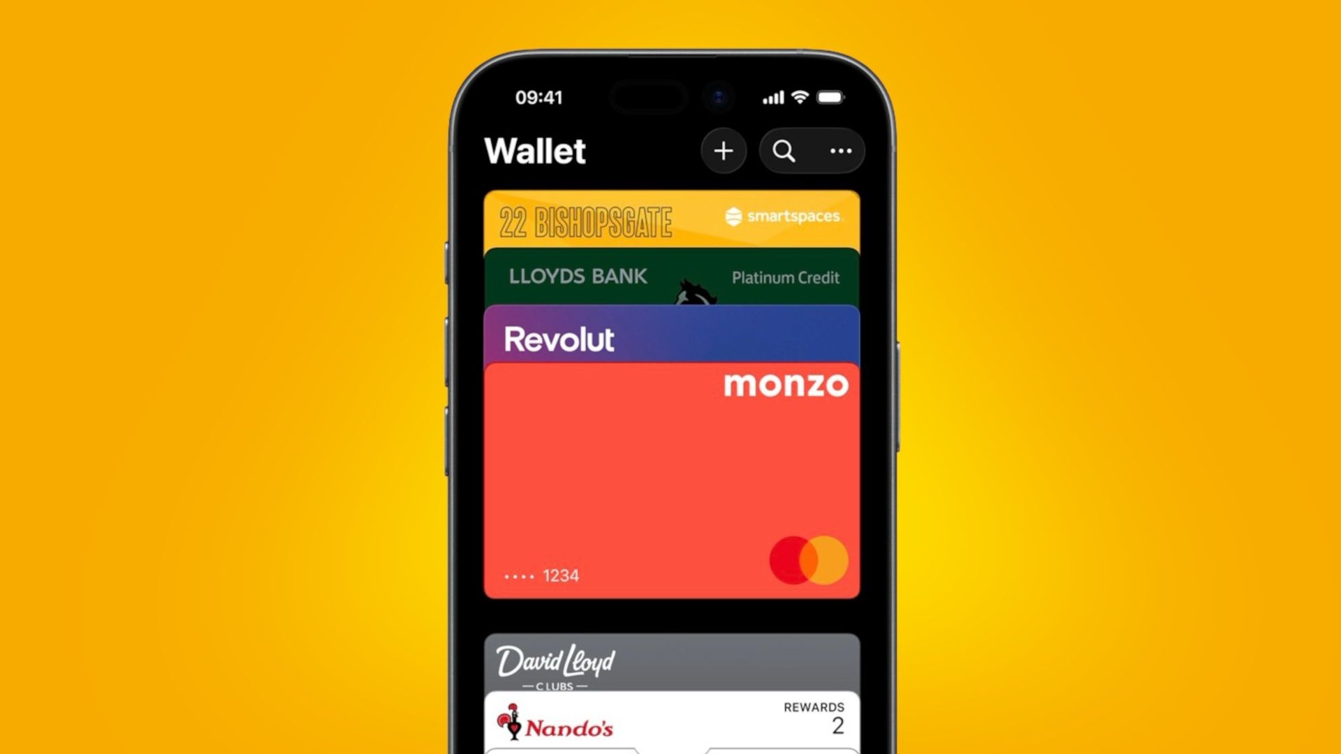 Smartphone displaying a mobile wallet with stacked colorful cards Nandos Revolut Monzo Lloyds Bank etc on a yellow background