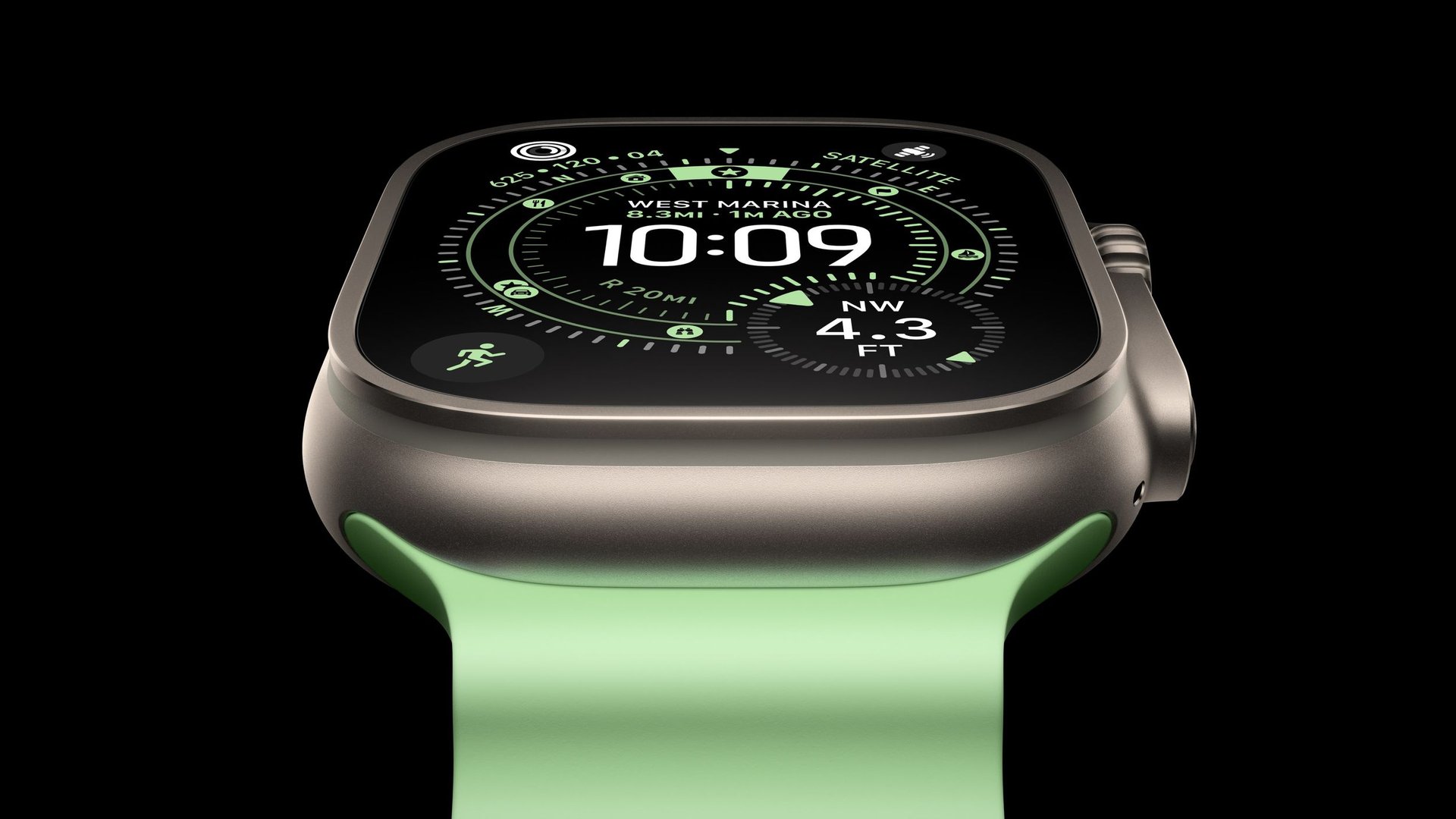 Close up of a smartwatch with a black face showing a time display and green navigation rings on a green band