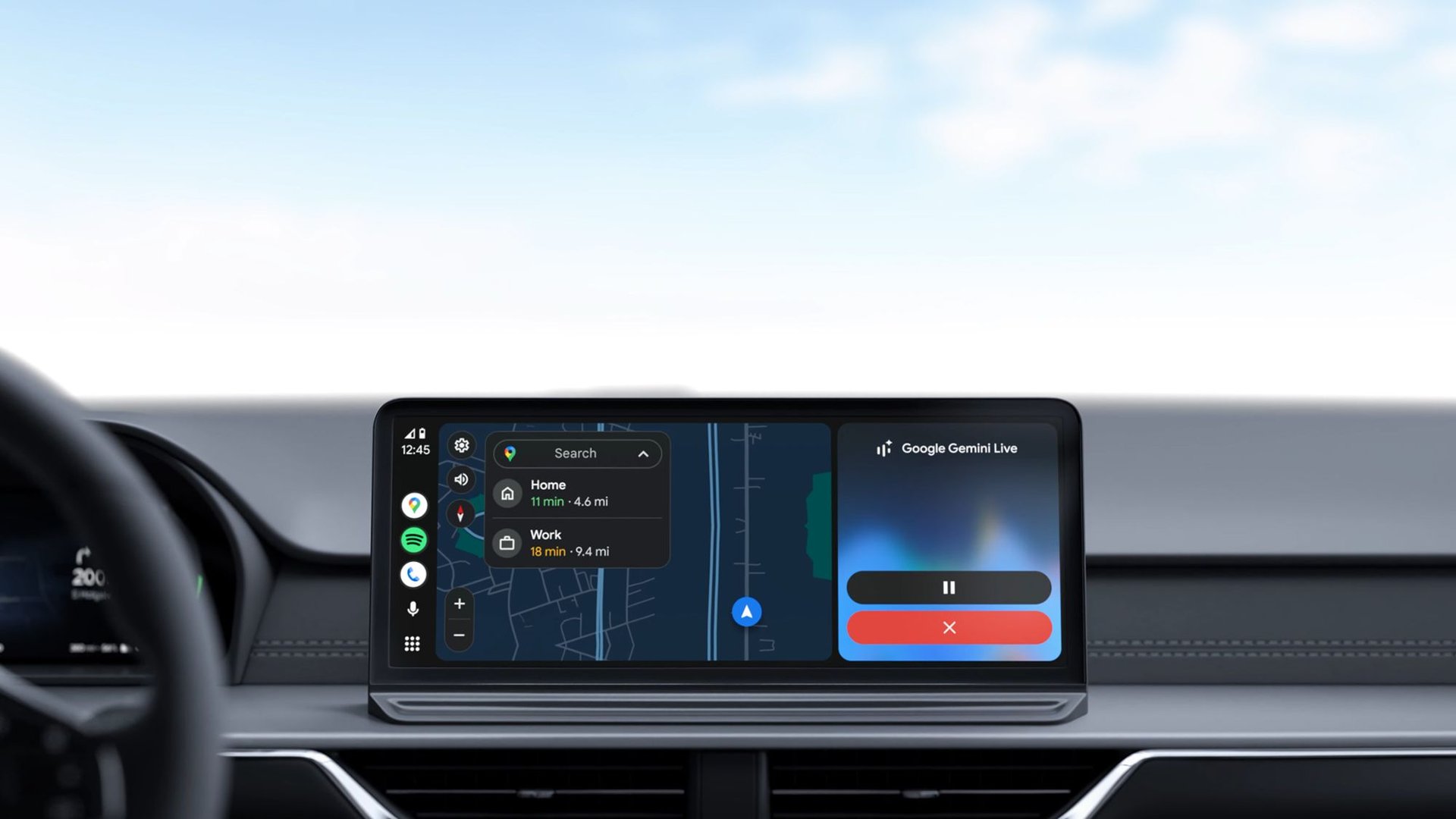Car dashboard with a wide touchscreen displaying navigation map and media controls