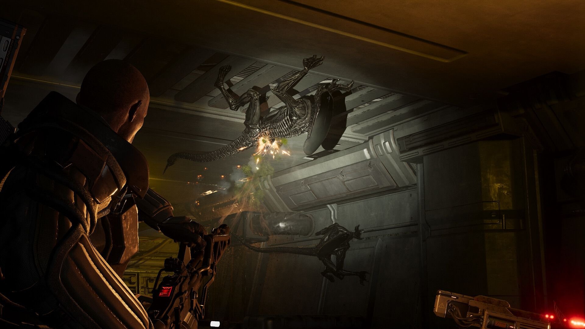 Soldier in heavy armor fires a weapon at a skeletal alien in a dim industrial corridor