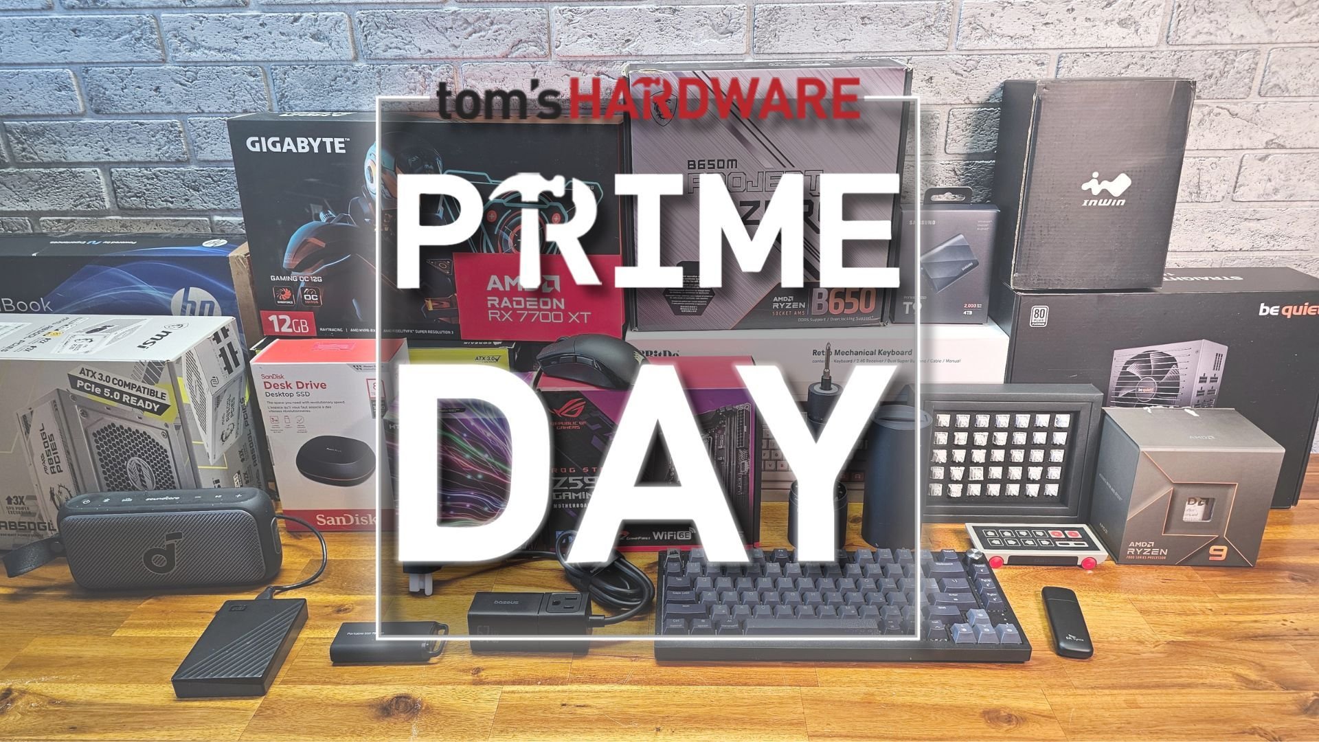 Promo image announcing Prime Day with a cluttered desk of computer hardware boxes and peripherals in the background