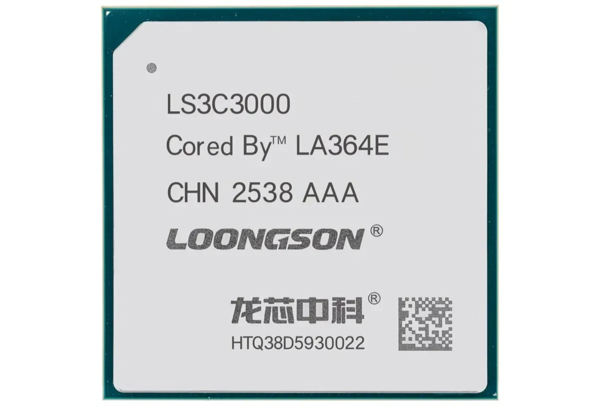 Close up of a Loongson processor die labeled LS3C3000 with model and QR code on a gray surface