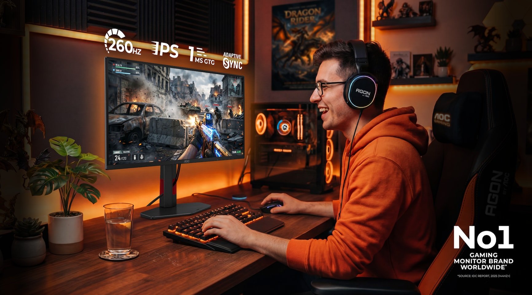 Gamer in an orange hoodie playing a lit up action game on a desktop monitor wearing large headphones in a cozy RGB lit setup with a No1 logo in the corner