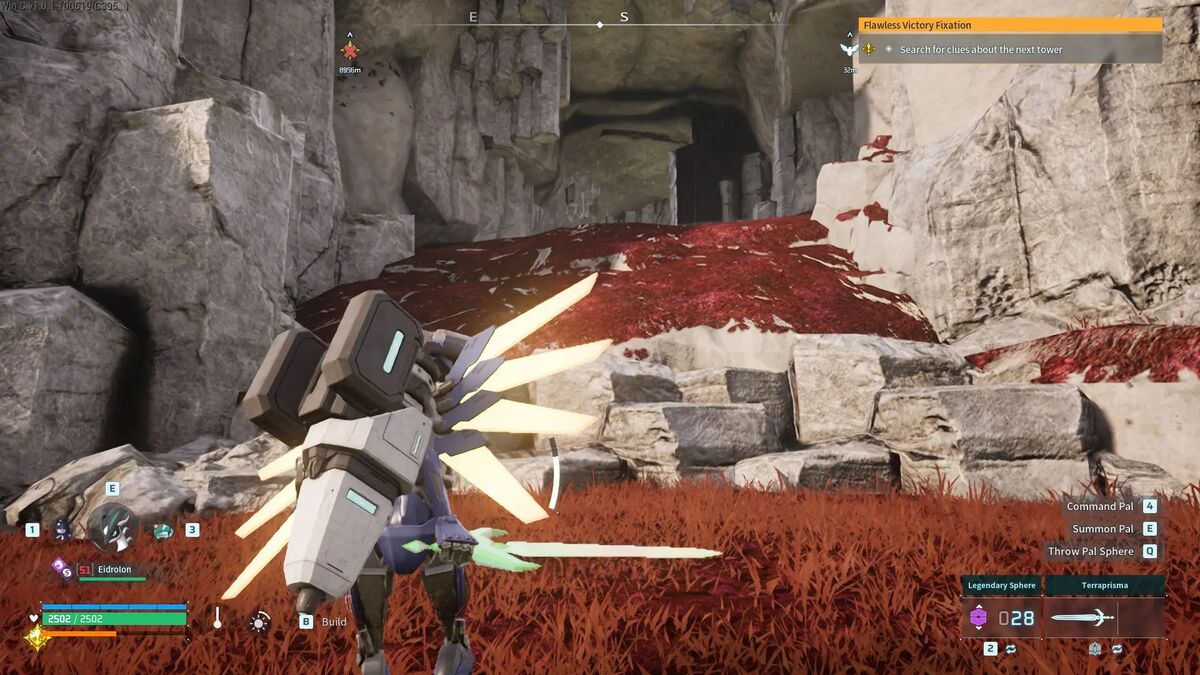 Character in an armored suit with glowing blades stands in a rocky cavern with red ground HUD visible health abilities objective