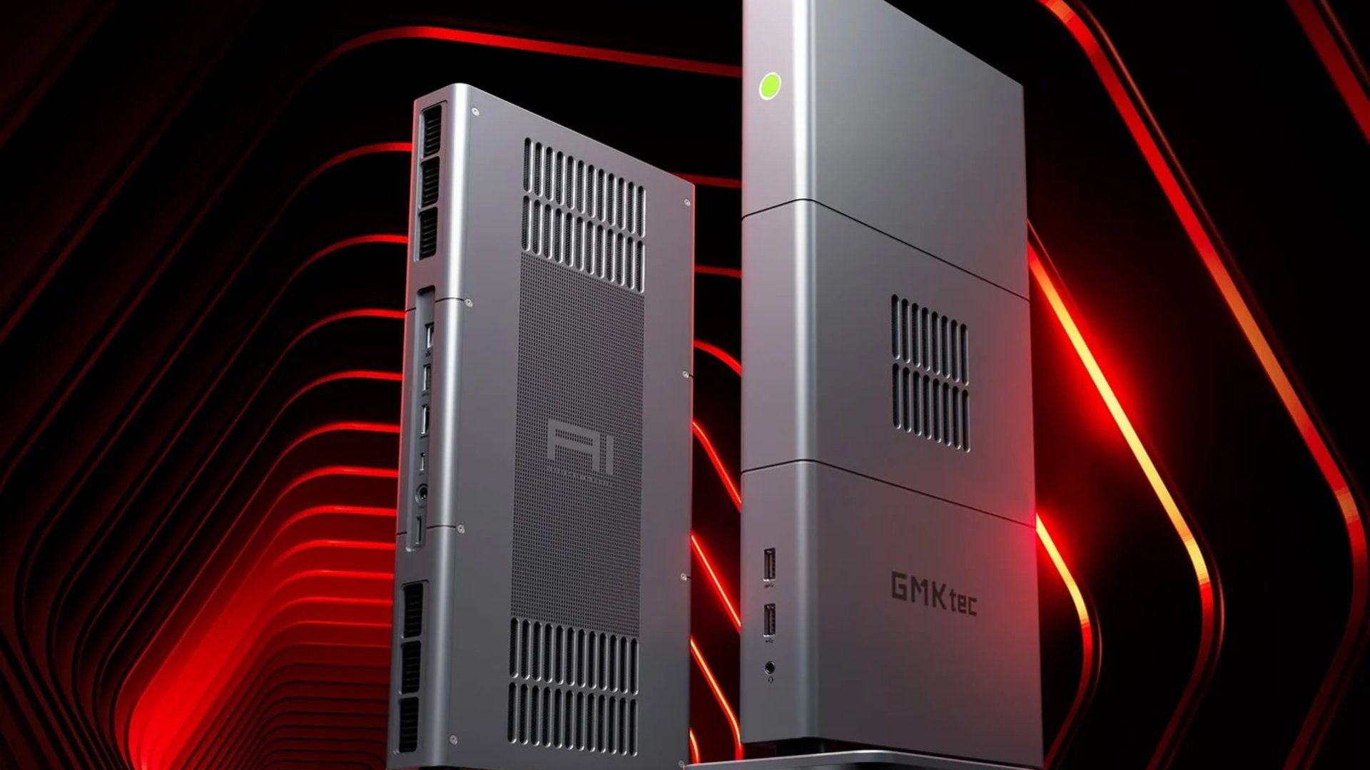 Two gray server towers with vented panels sit upright against a dark red neon lit backdrop one shows IO ports on its side the other has curved vent holes and a green power indicator