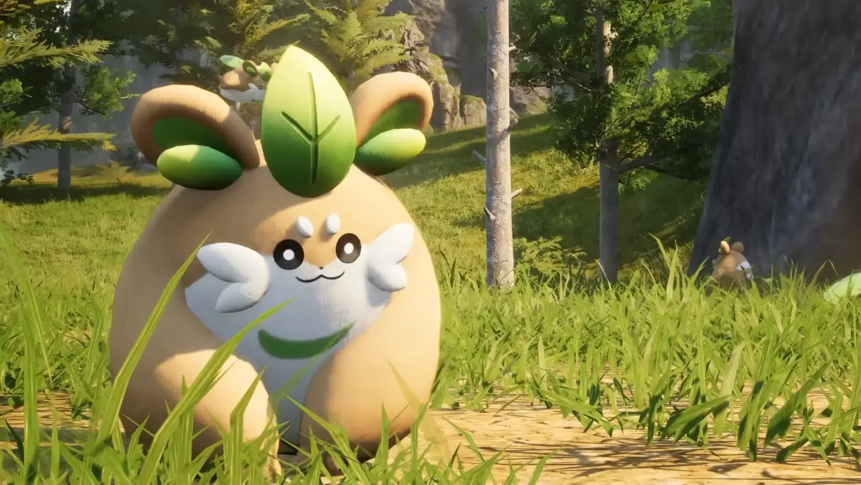 Rounded plush like woodland creature with green leaf ears sits in tall grass in a sunlit forest clearing