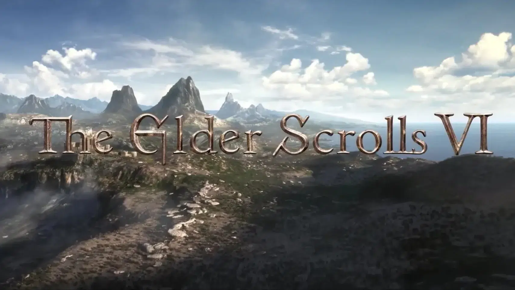 The Elder Scrolls VI title in bronze lettering across a rocky coastal landscape with jagged mountains under a blue sky