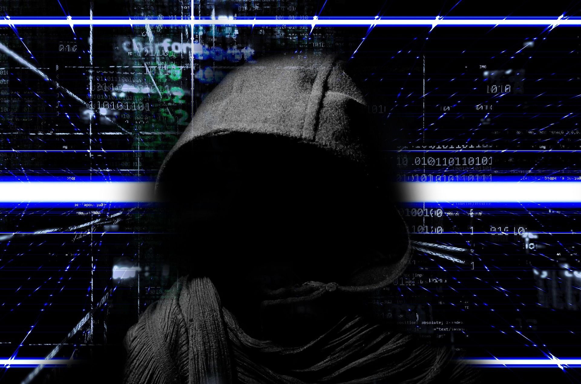Hooded silhouette facing forward in a dark hoodie with a digital matrix of blue light lines and code in the background suggesting a hacker theme